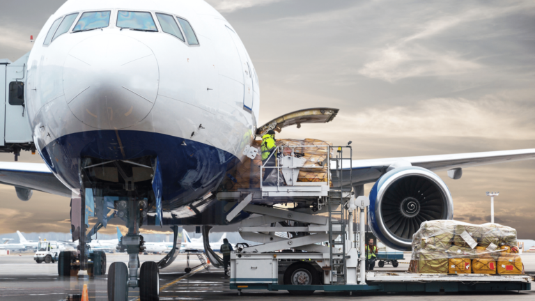 An airplane loading up air cargo for shipping