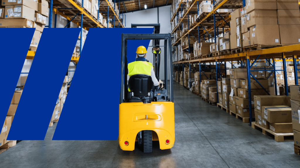 A forklift operator inside a warehouse managing the storage of items.